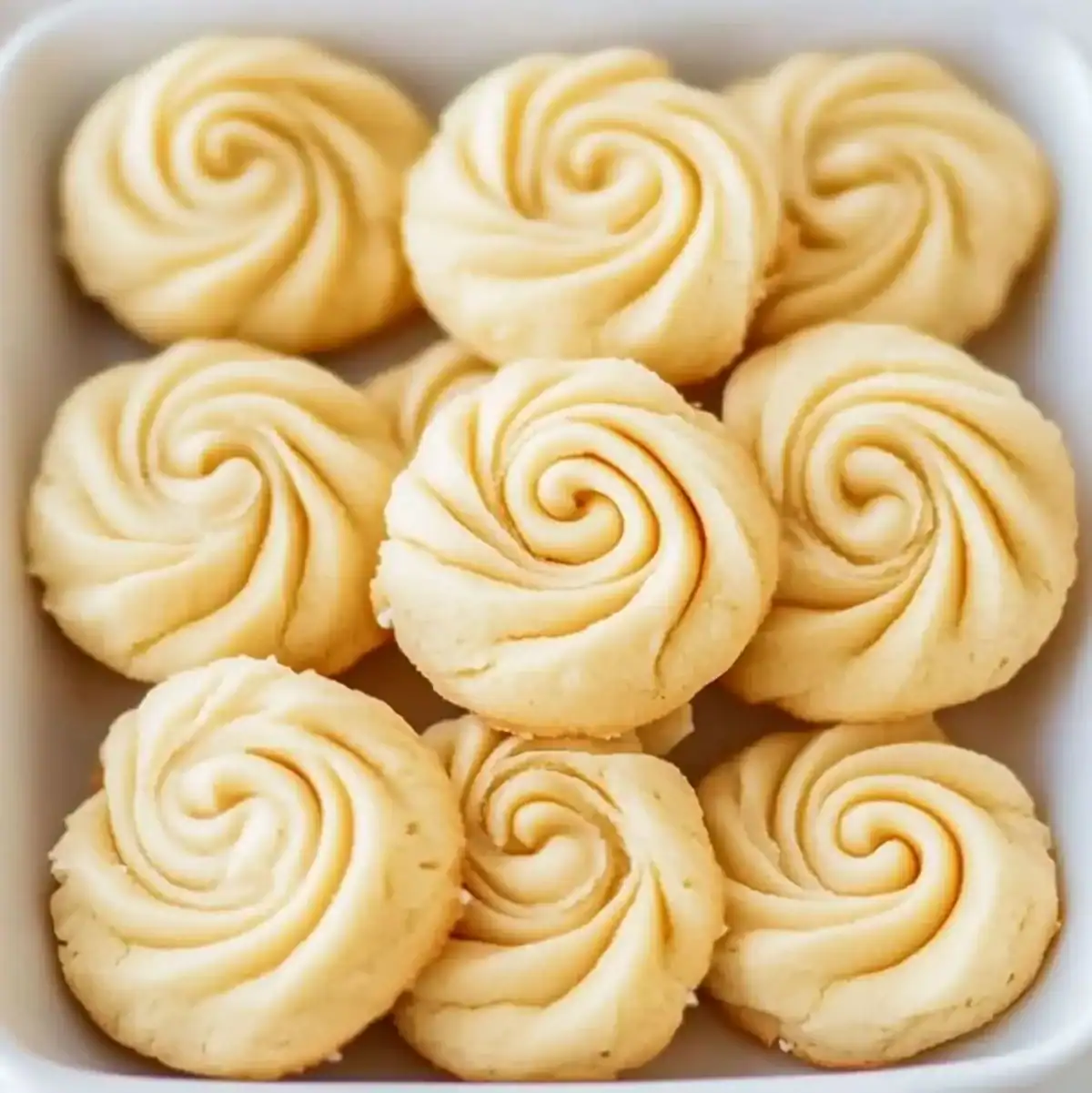 Swirled 3-ingredient butter cookies on a white tray