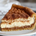 Churro Cheesecake Recipe – Easy Dessert Idea 66 Slice of churro cheesecake showing creamy layers and cinnamon topping