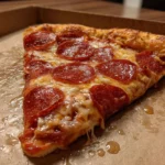 Costco Pizza Calories: Full Nutrition Breakdown 52 Close-up of Costco pepperoni pizza slice on cardboard tray
