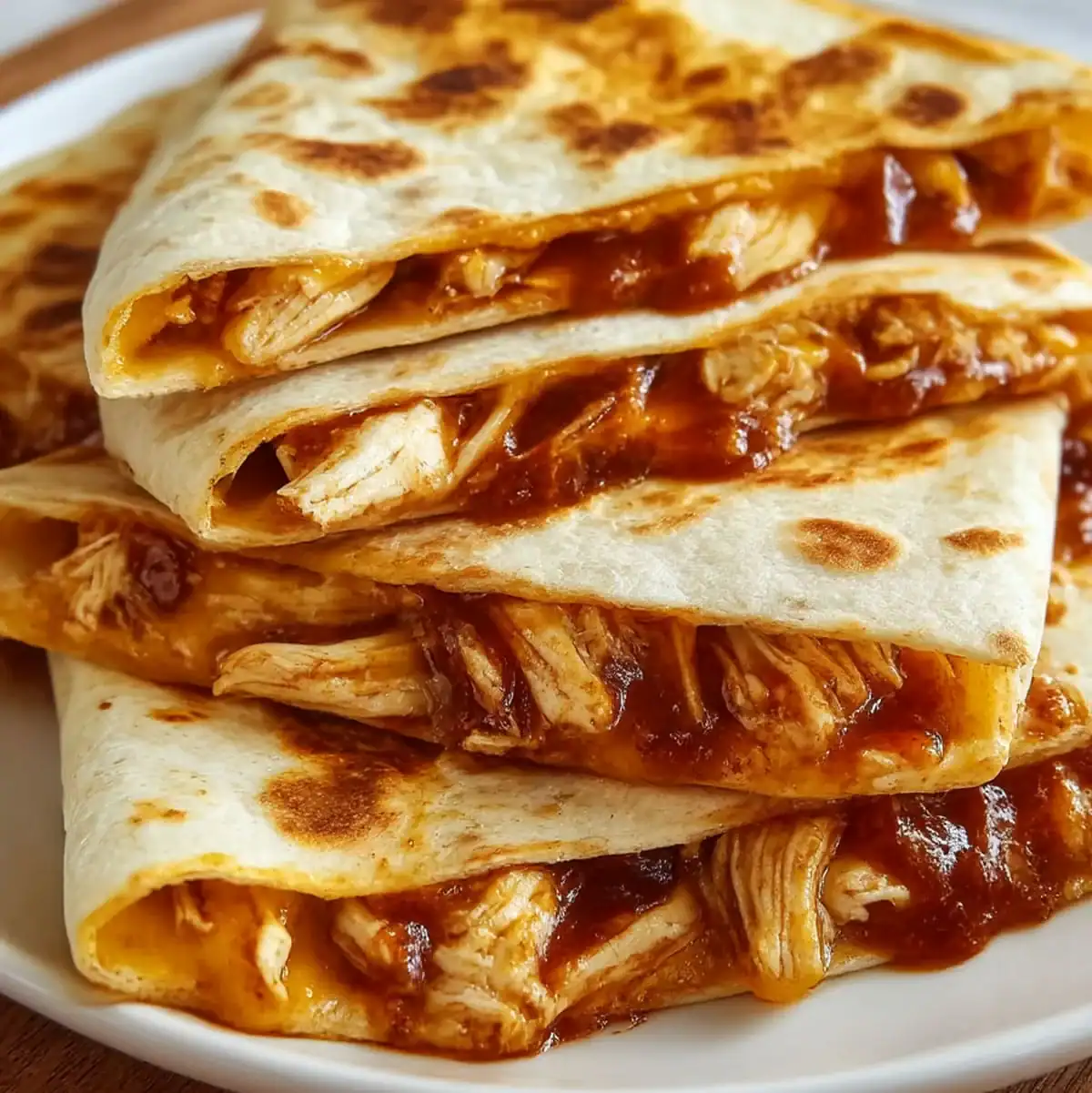 BBQ Chicken Quesadilla with smoky chicken, cheddar cheese, and golden crispy tortillas.
