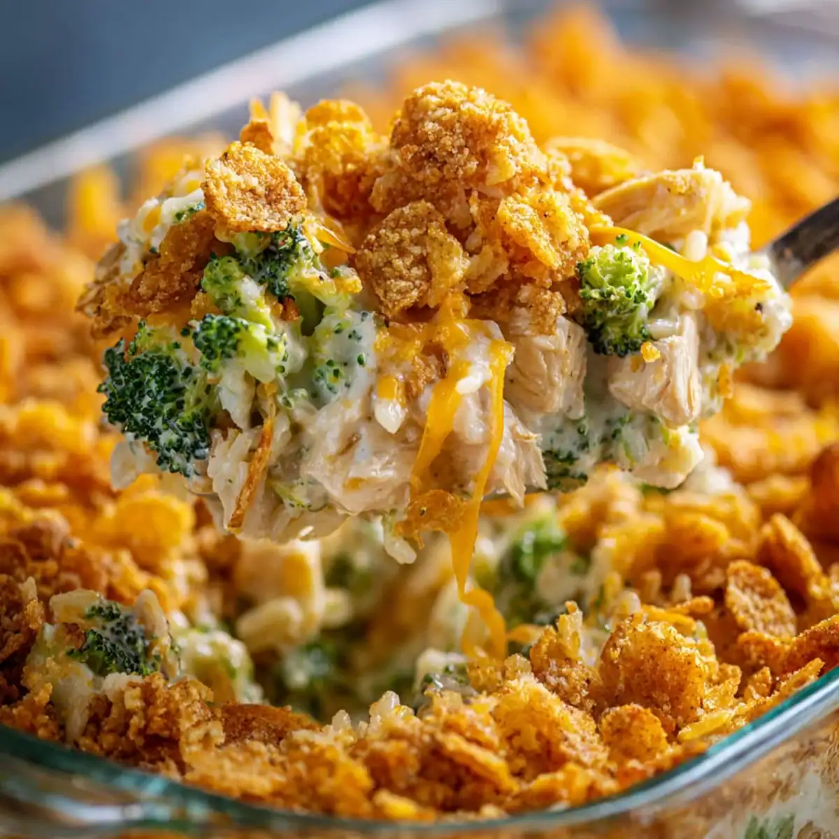 Best Cheesy Chicken Broccoli Rice Casserole 58 Easy homemade cheesy chicken broccoli rice casserole being served with a spoon.