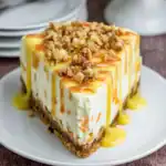 Carrot Cake Cheesecake – Easy Dessert Idea 86 Slice of carrot cake cheesecake with walnuts and caramel drizzle