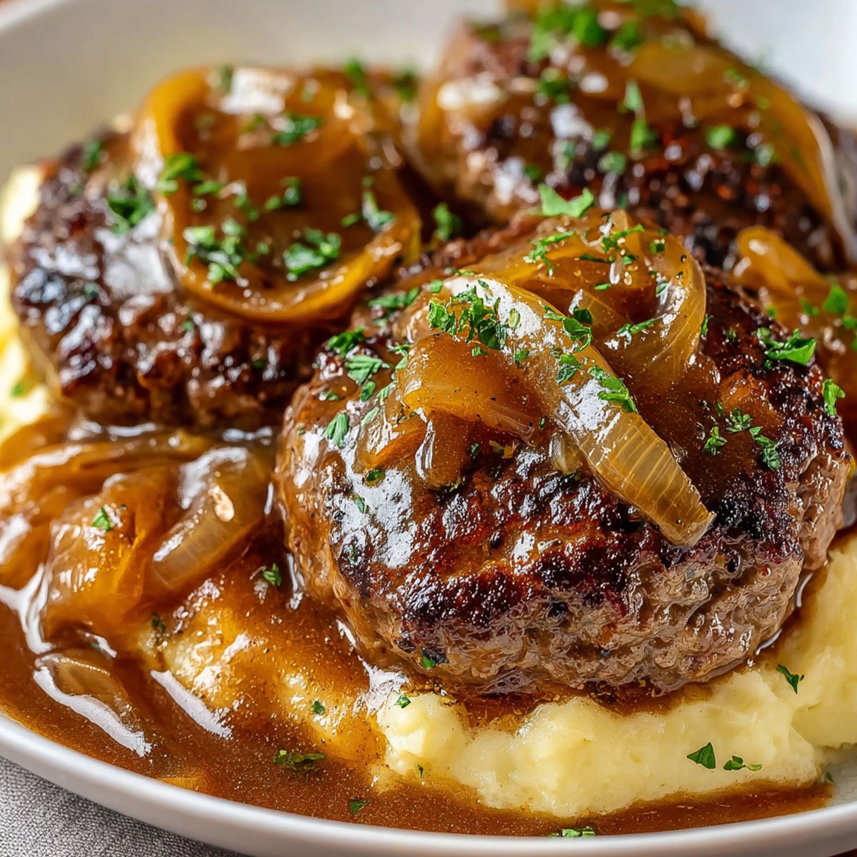 Amish Hamburger Steak Bake – Comfort Food Dinner Idea 76 Plated Amish Hamburger Steak Bake served with mashed potatoes and parsley garnish
