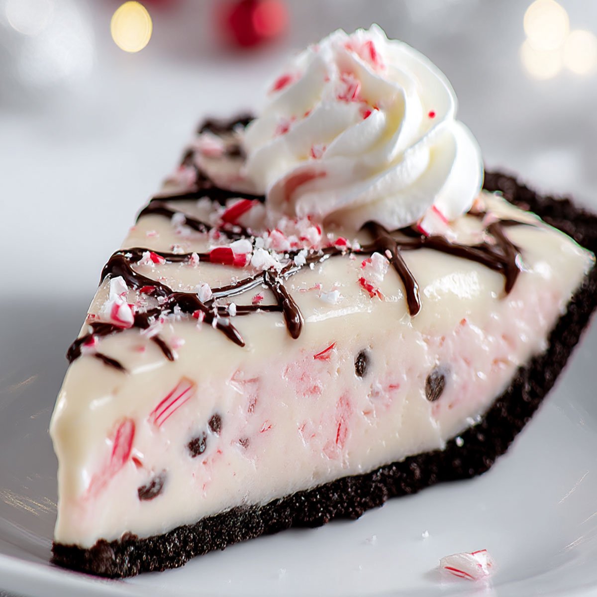 Candy Cane Pie Recipe – No-Bake Christmas Dessert 90 Festive Candy Cane Pie slice with whipped cream and crushed peppermint candy